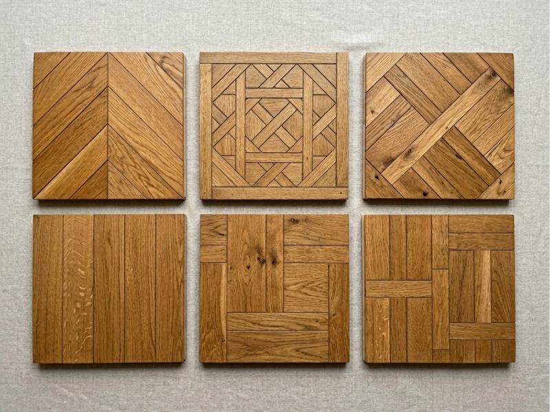 Les cinq grands motifs de parquet haussmannien parisien, du classique Point de Hongrie aux lames anglaises décalées : chaque motif raconte une époque et un quartier.
