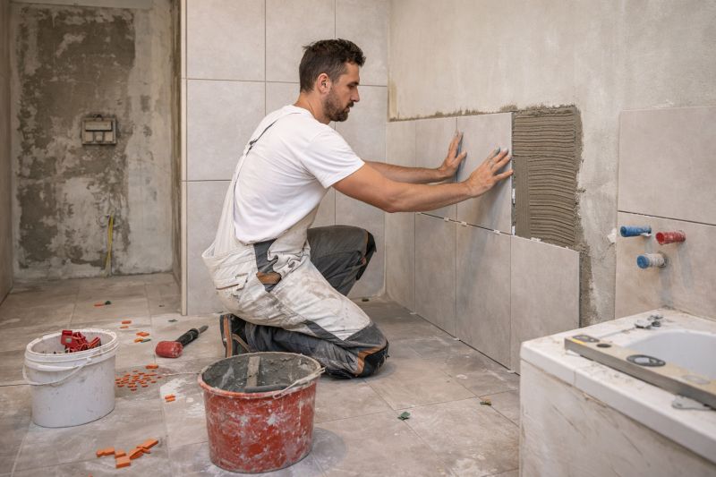 Pose de carrelage dans la salle de bain d'une maison à Neuilly sur Seine
